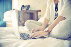 woman-working-on-bed